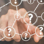 Person touching a question icon on a virtual screen