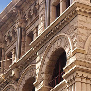 Close up of the architectural detailing of a refurbished heritage sandstone building. Now retail and office space. former headquarters for the American Equitable Life Assurance Society