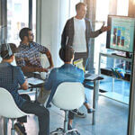 Shot of a young businessman giving a presentation in the boardroom