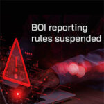 System hacked warning alert symbol with the words, "BOI reporting rules suspended"