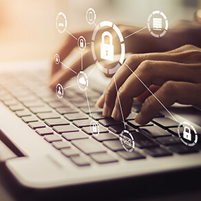 Hands typing on a keyboard with lock symbols overlaid over it