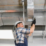 Hvac technician working on air conditioning unit