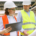 Builder and inspector discussing at a construction site