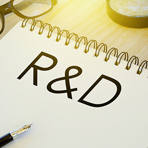 notebook written with R&D written in large type