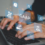 man hand using laptop virtual screen GAAP Generally Accepted Accounting Principles icons and symbols. Business financial concept.