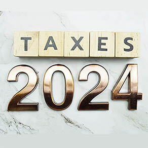 Taxes 2024 alphabet letter on marble background
