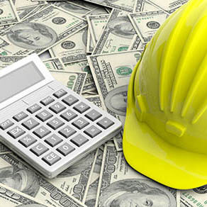 Construction hat and calculator laying on top of cash
