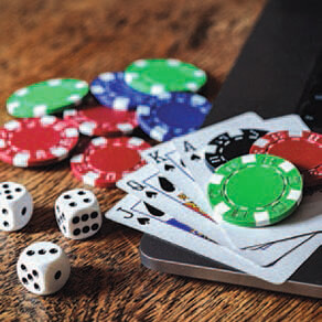 Poker chips, cards and dice in a pile