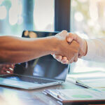 Businessman handshake at business meeting after negotiations with business partners.