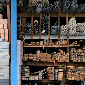 Construction building materials and industrial supplies stacked up on a shelving unit
