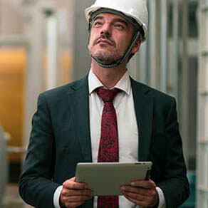 Portrait shot of senior engineer or management inspecting work in the boiler room in factory