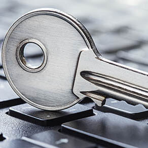 Key resting on computer keyboard