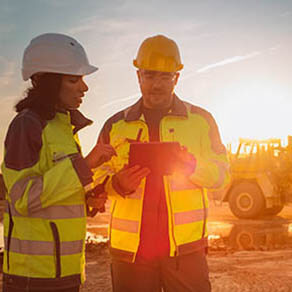 Two Construction Workers in discussion at a job site