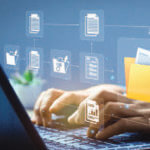 Hands typing on laptop with graphic images overlaid