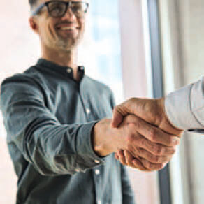 Two business men shaking hands