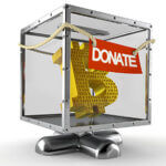 Glass box with gold letter "B" in it with the word "donate" written across it