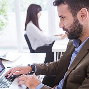 Man working to detect sales commission fraud