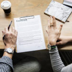 Man and woman looking at contract