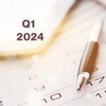 Calendar with pen and words "Q1 2024"