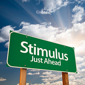 Stimulus Green Road Sign with Dramatic Clouds, Sun Rays and Sky.