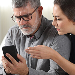 Man and Woman looking at phone