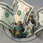 Money stuffed In opened part of sink drain