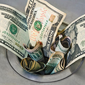 Money stuffed In opened part of sink drain