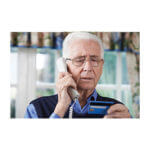 An elderly man on a phone