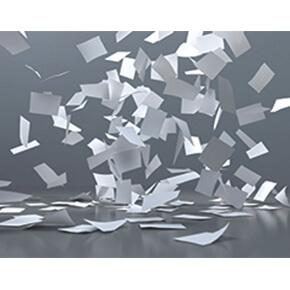 Pieces of gray and white paper flying around