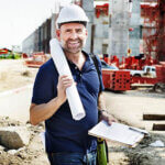 Architect On Construction Site holding site plans