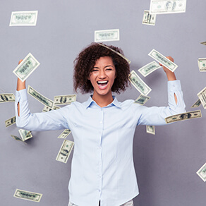 woman standing under rain with money on gray background