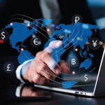 Laptop with map of the world laid over it