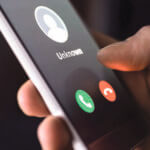 The photo illustrates someone receiving a phone call from an unknown number.