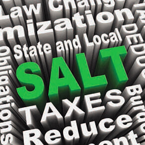 Tax-related three-D words with the word SALT in green in the middle