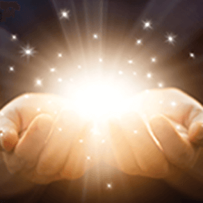 Two hands holding light and sparkles